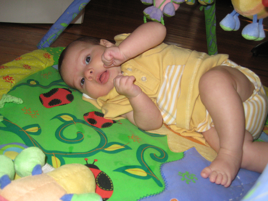 Lay babies down on the floor and let them explore the most interesting "toys" they have - their body parts and their environment!